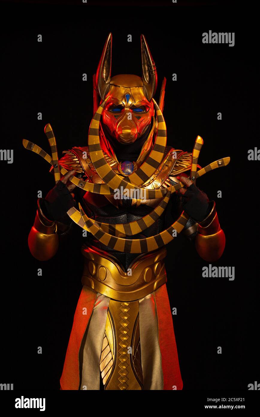 a male actor in a suit of an Egyptian mythology character, the golden ...