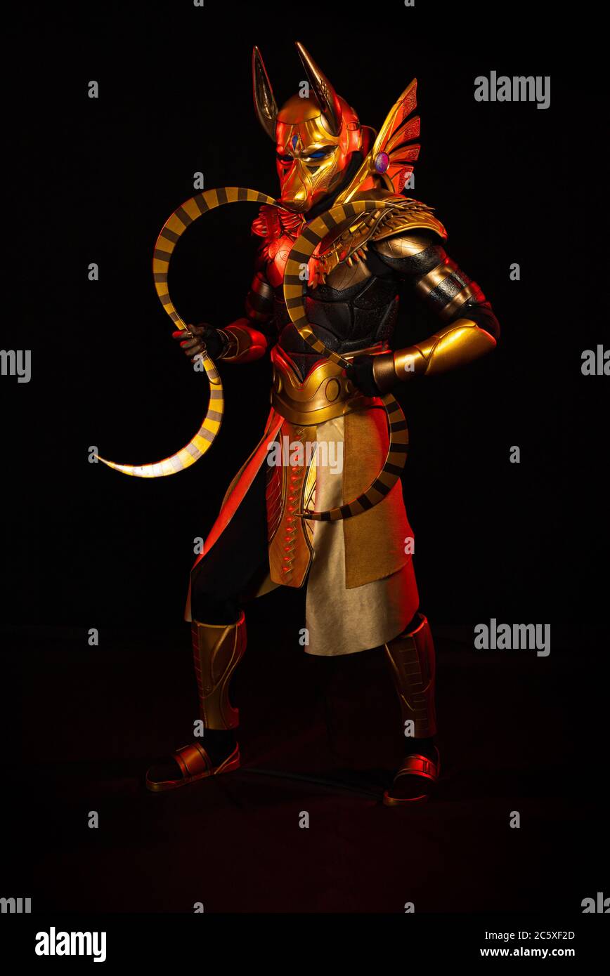 a male actor in a suit of an Egyptian mythology character, the golden ...