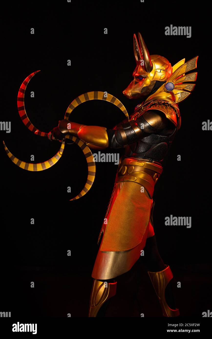 a male actor in a suit of an Egyptian mythology character, the golden ...