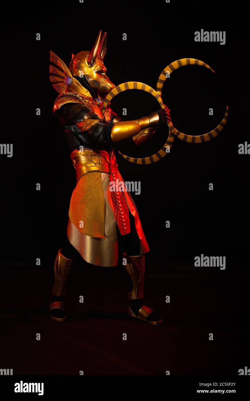 a male actor in a suit of an Egyptian mythology character, the golden ...