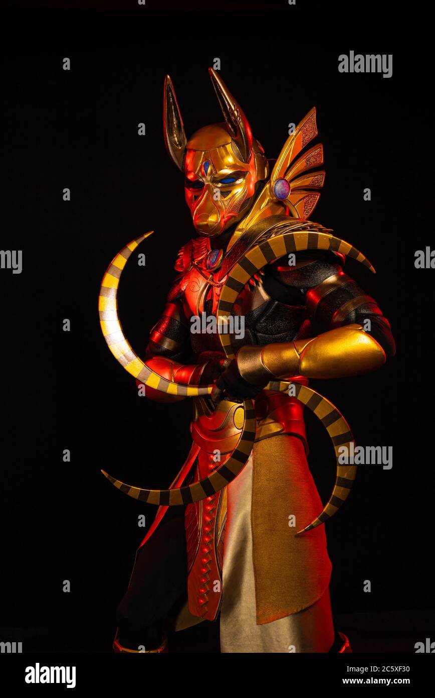a male actor in a suit of an Egyptian mythology character, the golden ...