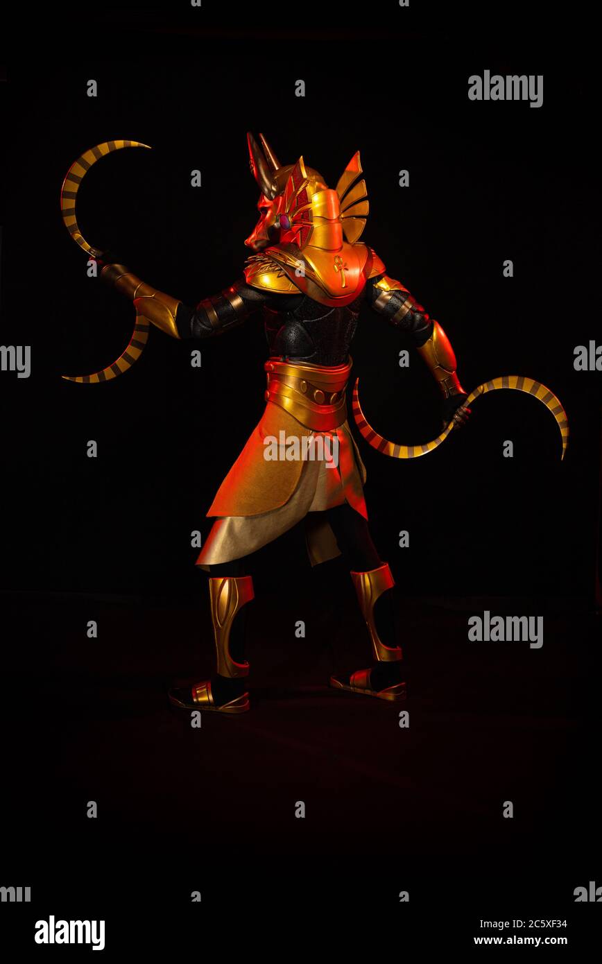 a male actor in a suit of an Egyptian mythology character, the golden ...