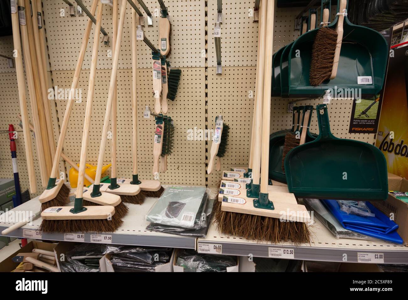 Brooms and brushes on display in Garden center Kent, England Stock