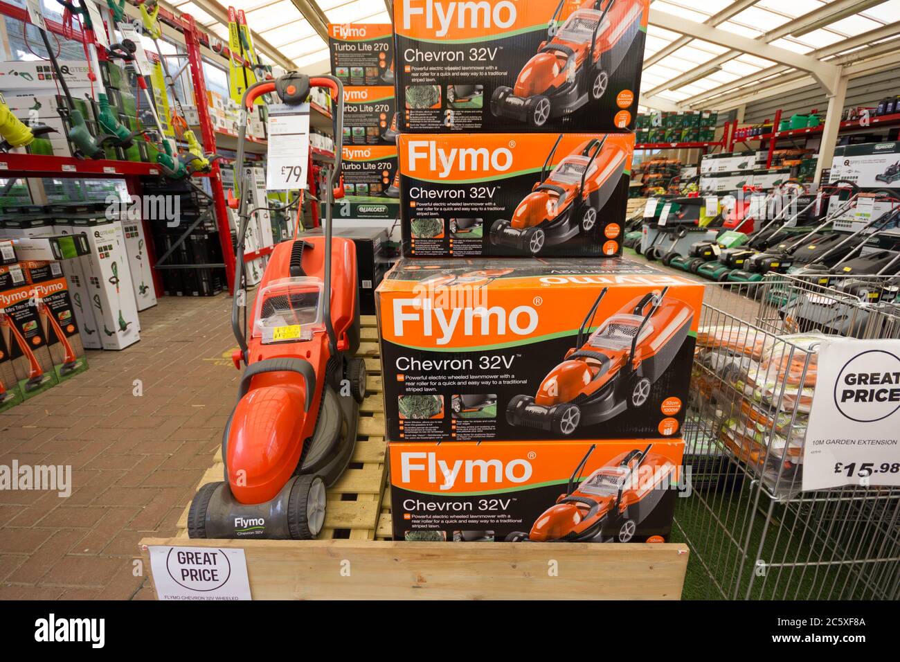 Flymo lawn mower on display in garden centre retailer Homebase Stock Photo