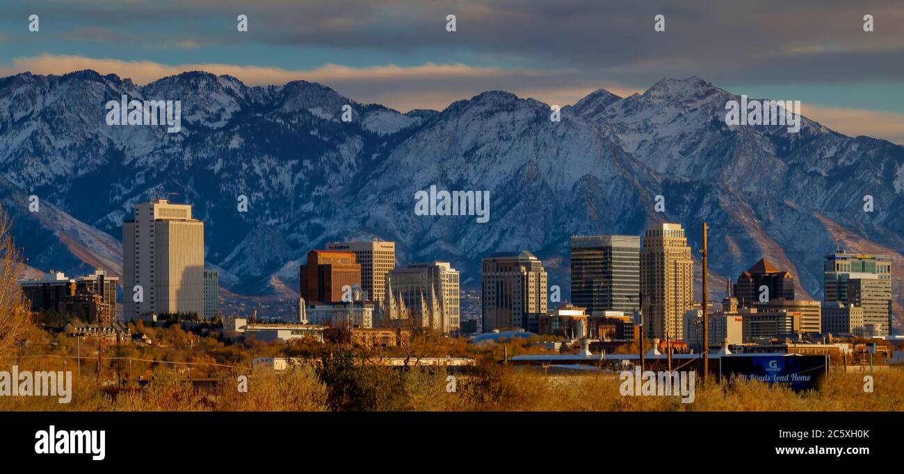 A Winter overview of the downtown part of Salt Lake City with the Wasatch Mountain Range in the background. Stock Photo