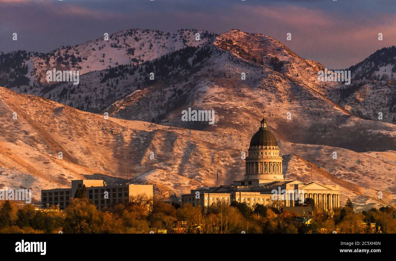 The State Capitol building of Salt Lake city seen against a backdrop of snow covered mountains. Stock Photo