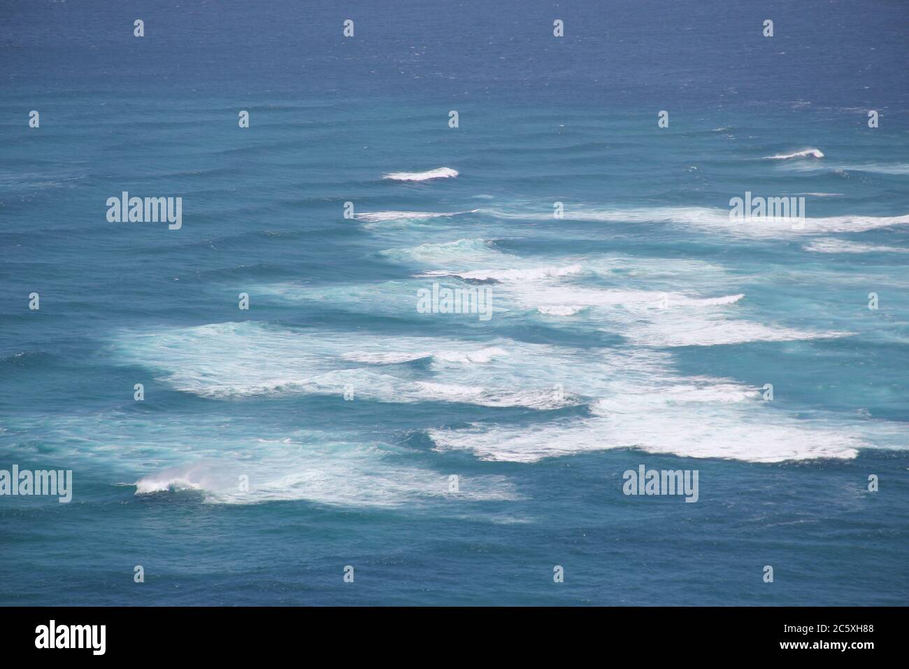 White caps on the Pacific Ocean at Cape Reinga at the top of NZ Stock Photo