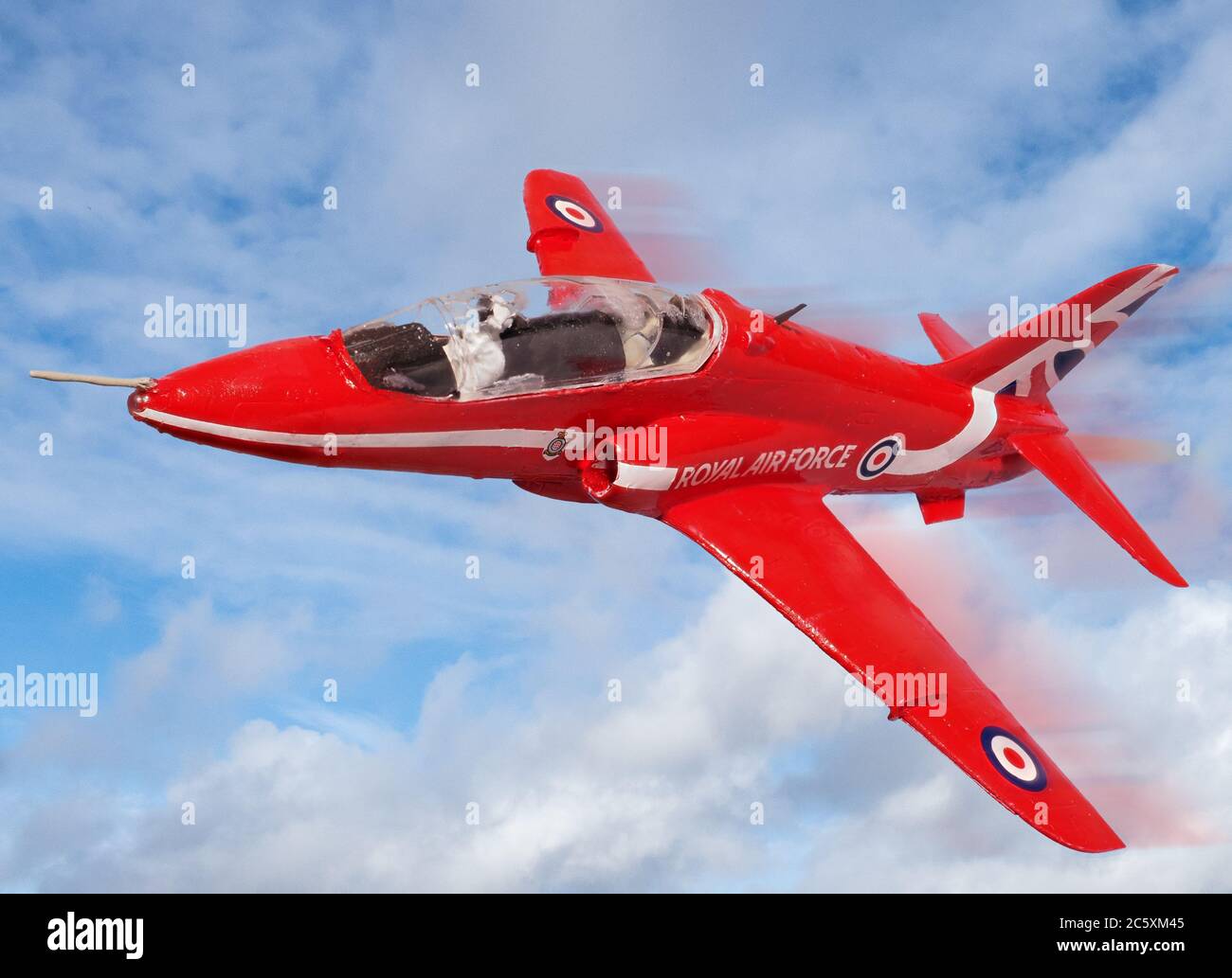 Model Red Arrows Hawk from Airfix kit flies through the sky Stock Photo