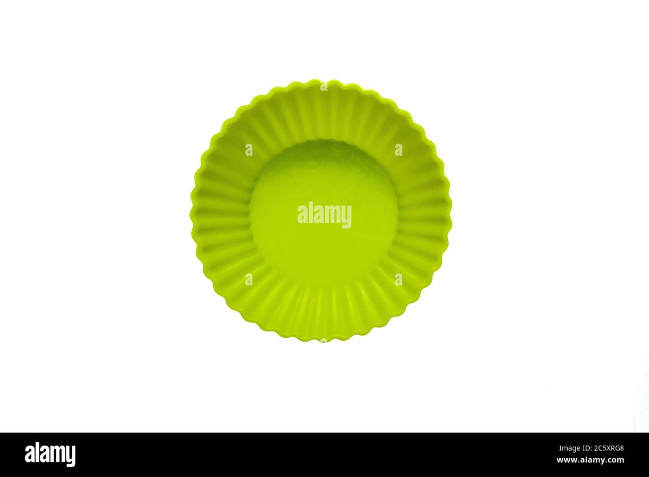 Green silicone cupcake baking dish isolated on white background Stock Photo