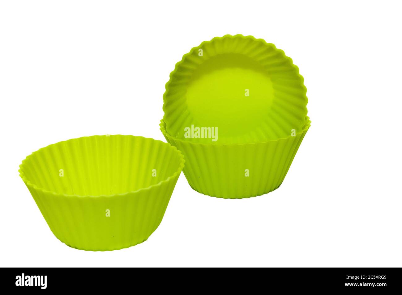Green silicone cupcake baking dish isolated on white background Stock Photo