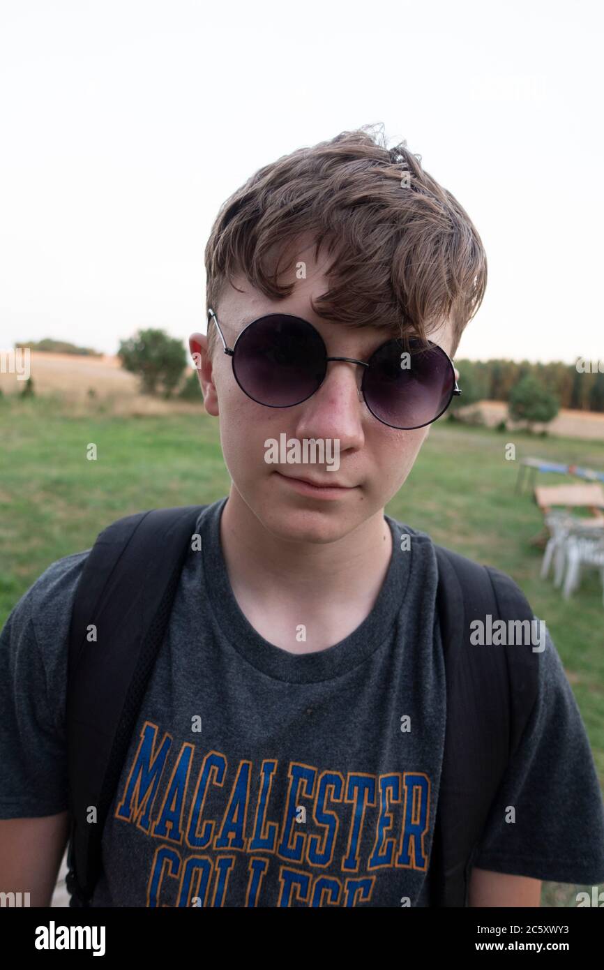 Teenage boy wearing sunglasses hi-res stock photography and images - Alamy