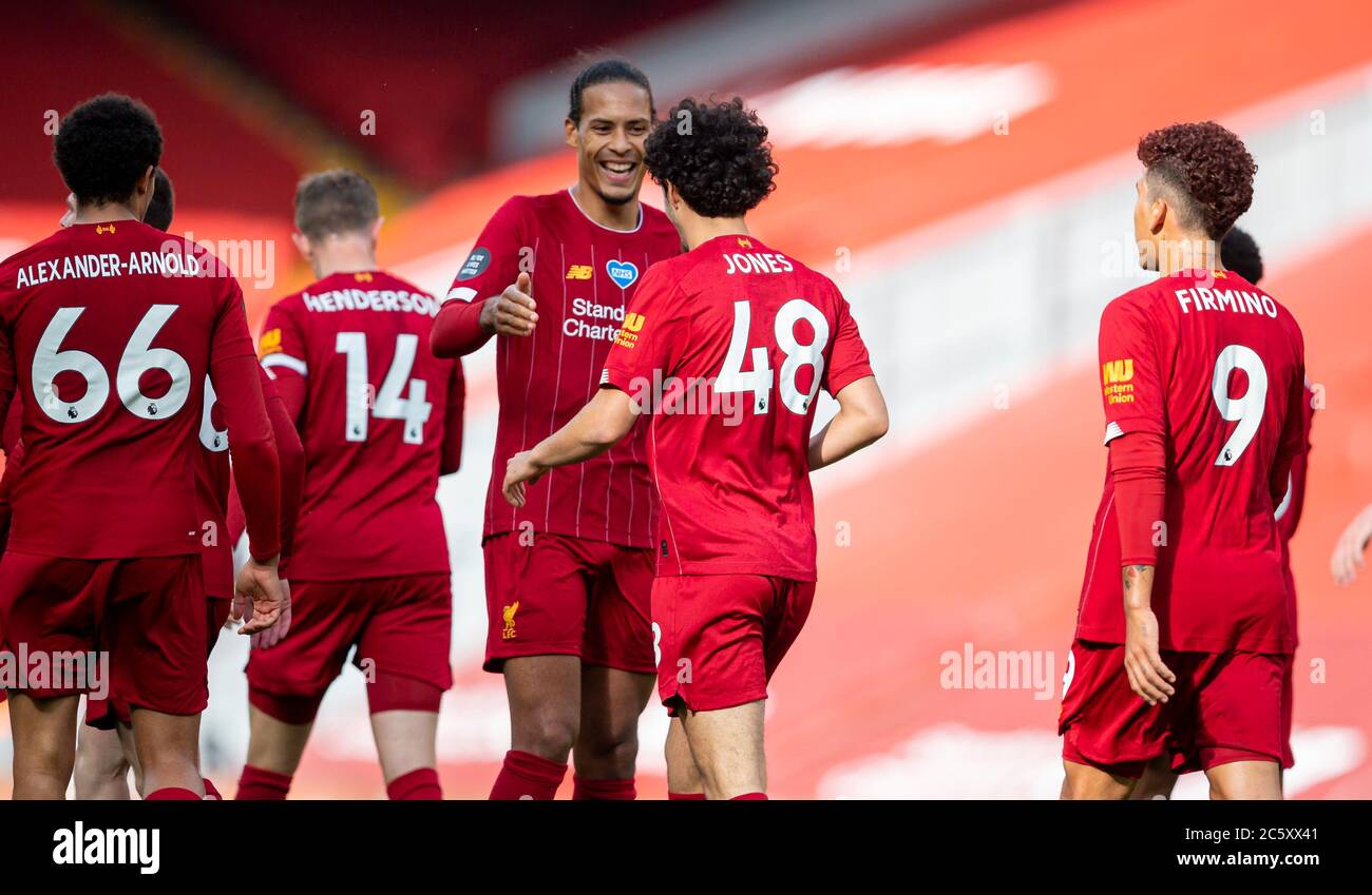 Liverpool. 6th July, 2020. Liverpool's Curtis Jones (2nd R) celebrates after scoring a goal with teammate Virgil van Dijk (3rd R) during the Premier League match between Liverpool and Aston Villa at Anfield in Liverpool, Britain on July 5, 2020.FOR EDITORIAL USE ONLY. NOT FOR SALE FOR MARKETING OR ADVERTISING CAMPAIGNS. NO USE WITH UNAUTHORIZED AUDIO, VIDEO, DATA, FIXTURE LISTS, CLUB/LEAGUE LOGOS OR "LIVE" SERVICES. ONLINE IN-MATCH USE LIMITED TO 45 IMAGES, NO VIDEO EMULATION. NO USE IN BETTING, GAMES OR SINGLE CLUB/LEAGUE/PLAYER PUBLICATIONS. Credit: Xinhua/Alamy Live News Stock Photo
