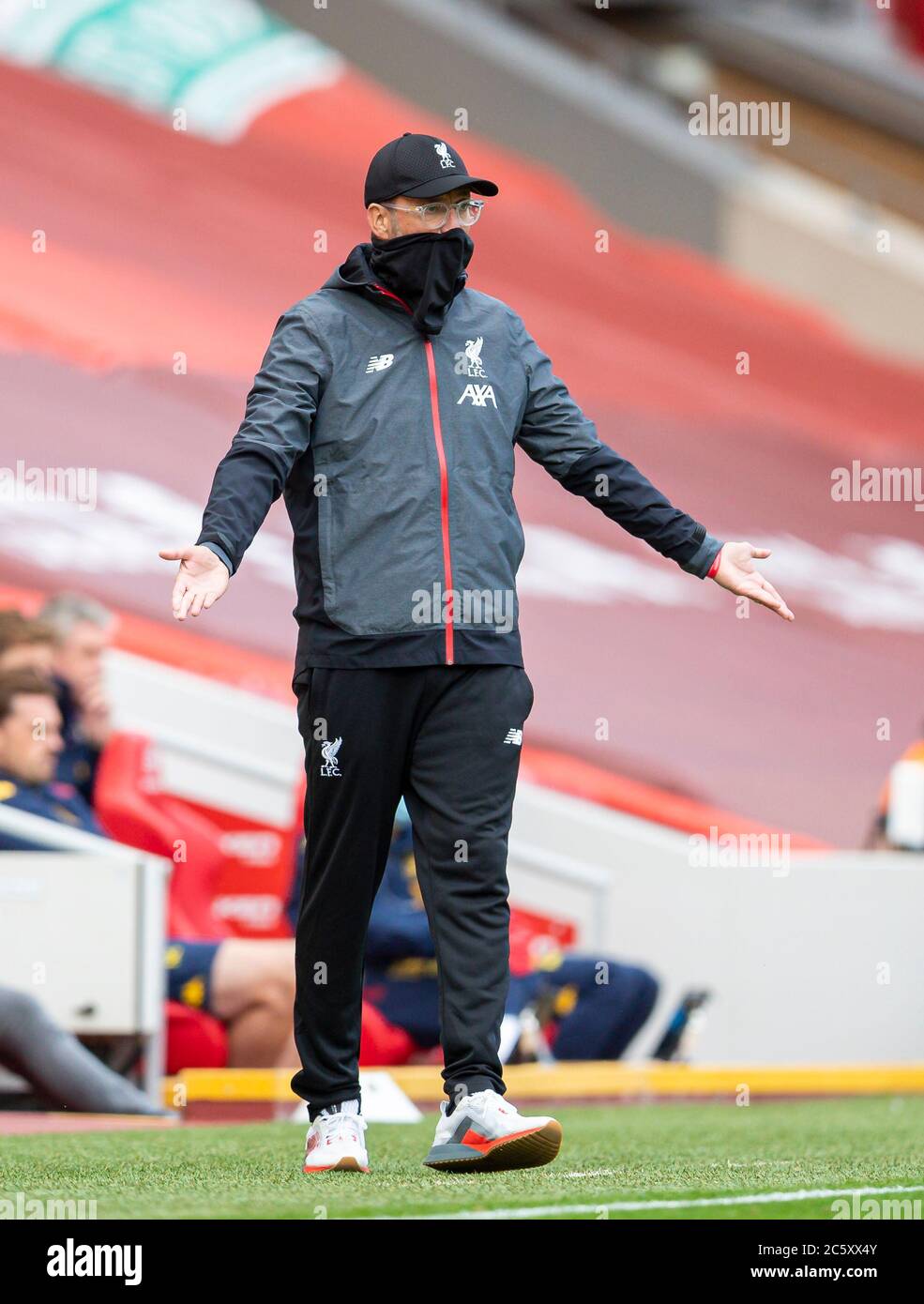Liverpool. 6th July, 2020. Liverpool's manager Jurgen Klopp wears a face covering during the Premier League match between Liverpool and Aston Villa at Anfield in Liverpool, Britain on July 5, 2020.FOR EDITORIAL USE ONLY. NOT FOR SALE FOR MARKETING OR ADVERTISING CAMPAIGNS. NO USE WITH UNAUTHORIZED AUDIO, VIDEO, DATA, FIXTURE LISTS, CLUB/LEAGUE LOGOS OR "LIVE" SERVICES. ONLINE IN-MATCH USE LIMITED TO 45 IMAGES, NO VIDEO EMULATION. NO USE IN BETTING, GAMES OR SINGLE CLUB/LEAGUE/PLAYER PUBLICATIONS. Credit: Xinhua/Alamy Live News Stock Photo