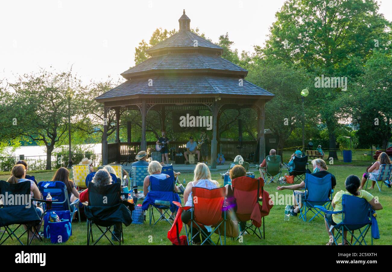 McGowan Park Summer Concerts- Sandy Stones Trio Band with social distancing spectators Stock Photo