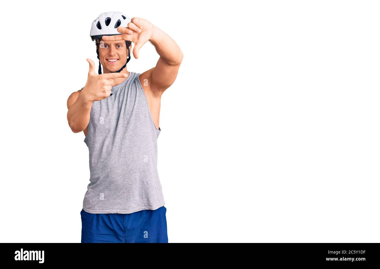 Young Handsome Man Wearing Bike Helmet Smiling Making Frame With Hands