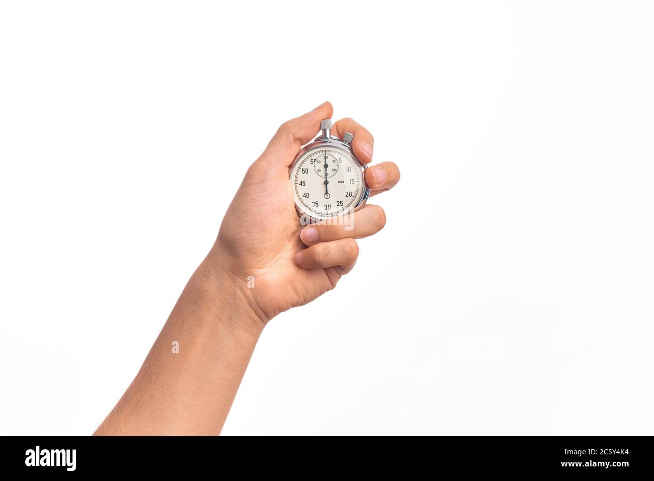 Hand of caucasian young man doing countdown holding stopwatch over ...