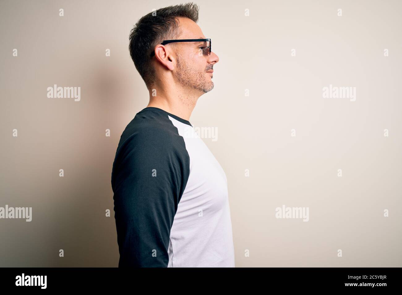 Young Handsome Man Wearing Funny Thug Life Sunglasses Meme Over White Background Looking To Side Relax Profile Pose With Natural Face With Confident Stock Photo Alamy