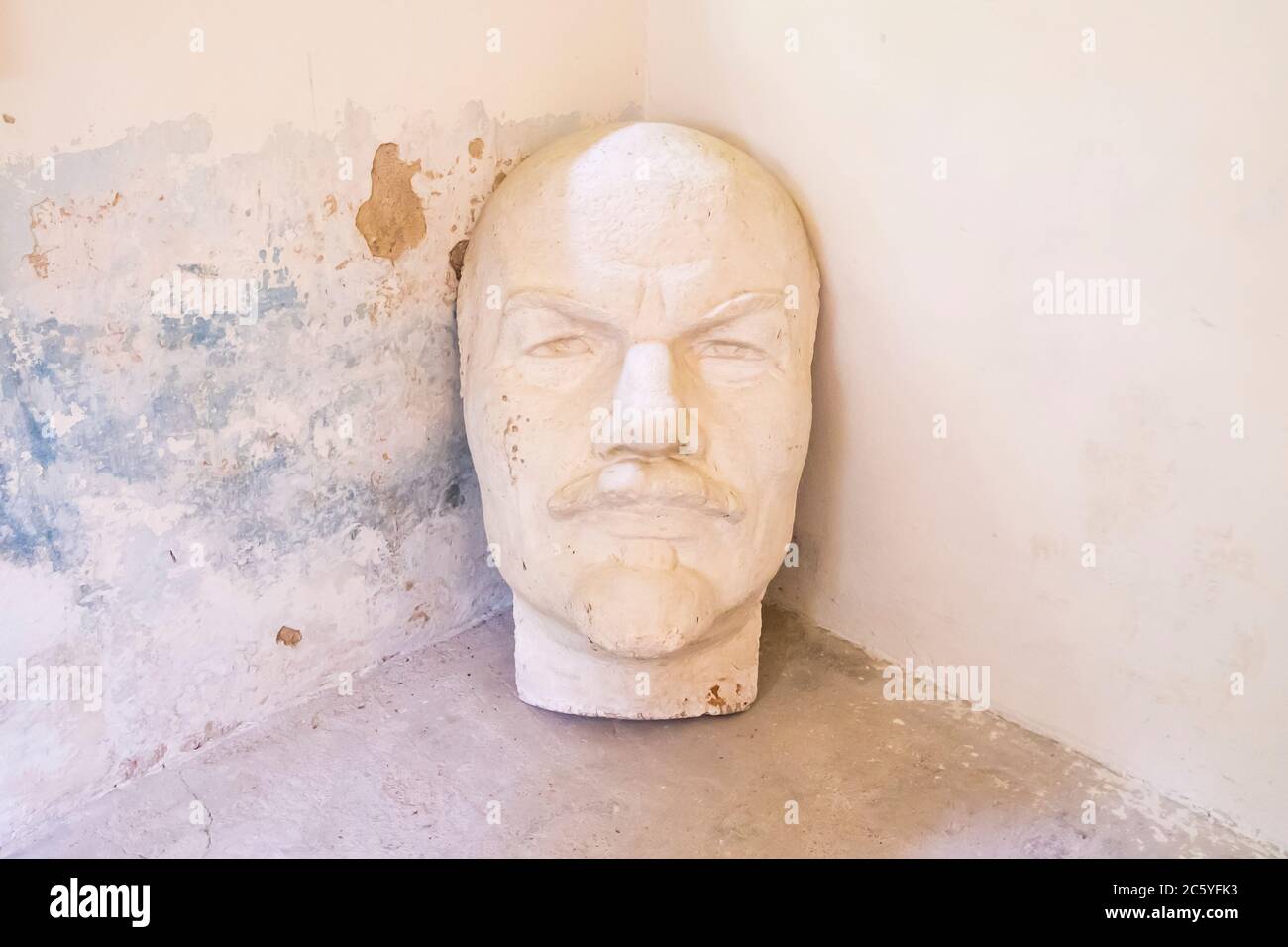 A bust of Lenin in a former prison building used by the German Nazis during WWII as a concentration camp headquarters. In Macikai, Lithuania. Stock Photo