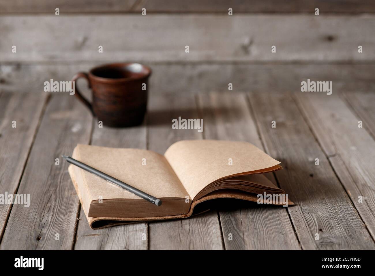 Office desk with blank screen smartphone,pen,notebook and coffee cup on wood table.Top view with copy space.Office supplies and gadgets on desk table.Working desk table concept.Flat lay image. Stock Photo
