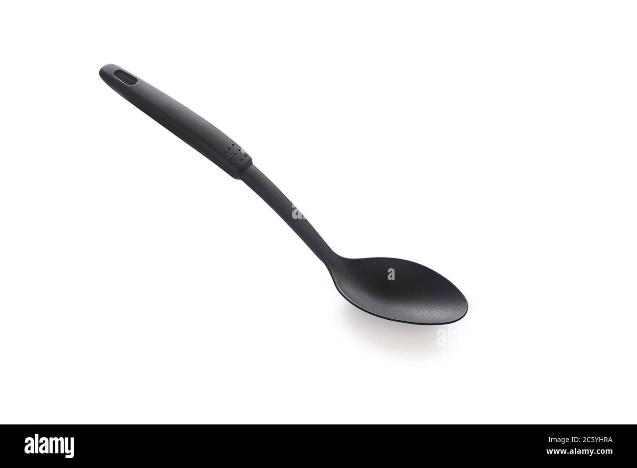 Modern non stick plastic ladle in black color for stir soup or scoop on white isolated background with clipping path. Perfect studio shot cookware and Stock Photo