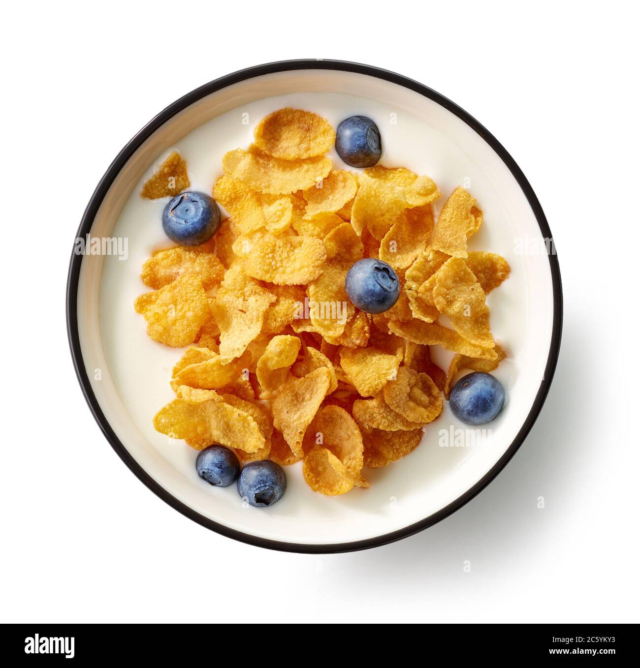bowl of cornflakes and milk decorated with blueberries isolated on white background, top view Stock Photo