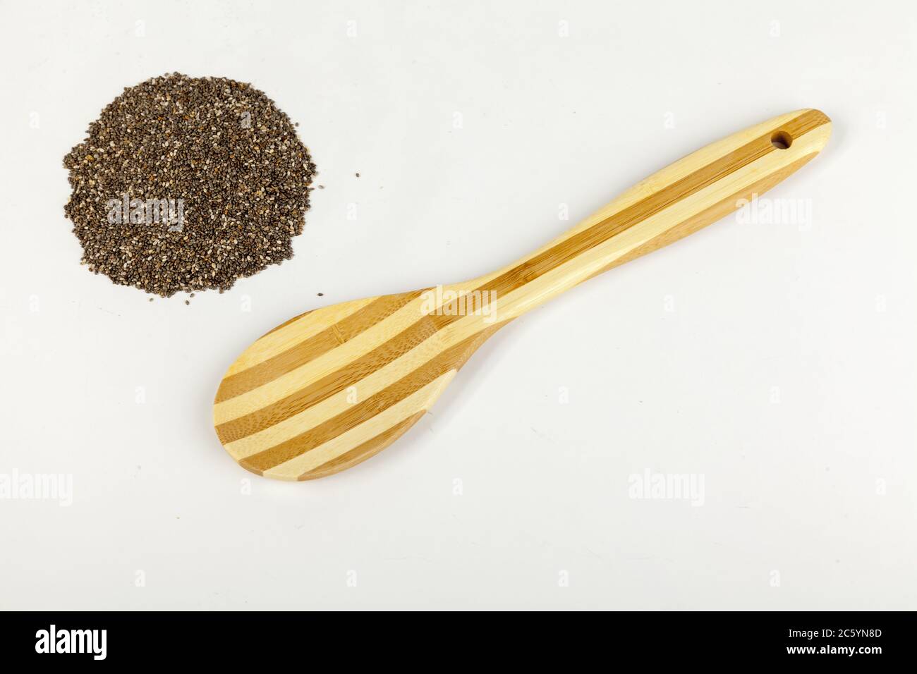 woodem spoonwith chia seeds isolated on white Stock Photo