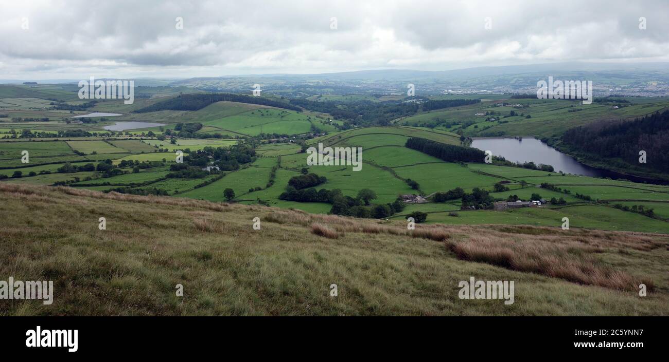 Black Moss Reservoirs, Lower Ogden Reservoir & the Village of Barley from near the Summit of Pendle Hill, Lancashire, England, UK. Stock Photo