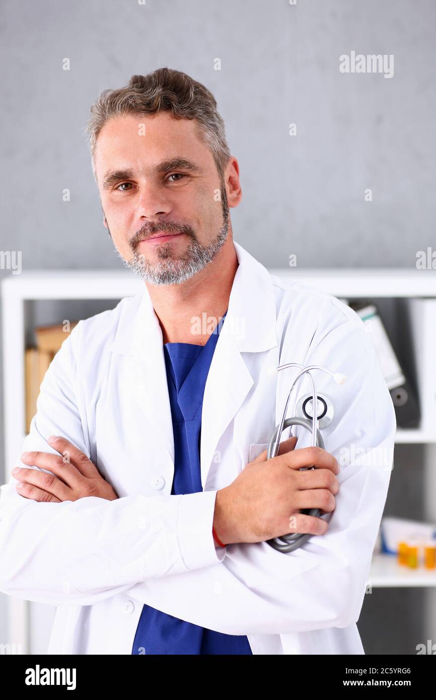 Smiling mature doctor phonendoscope hi-res stock photography and images ...