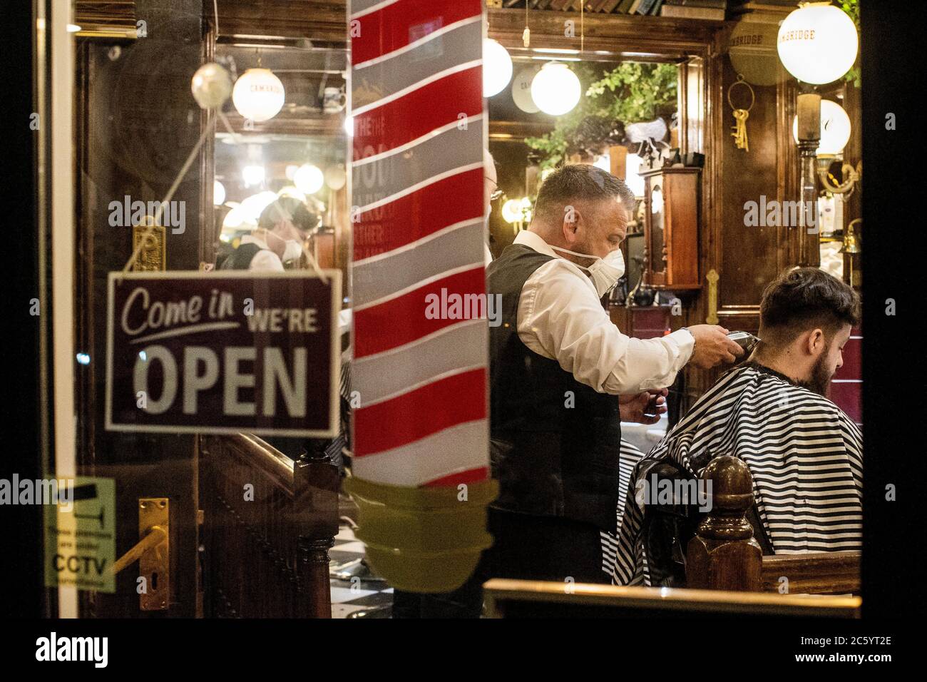 Cambridge Barbershop on Belfast's Lisburn Road, which opened at 00:01, as hairdressers and beauty salons reopen in Northern Ireland, part of the latest measure to ease coronavirus restrictions. Stock Photo