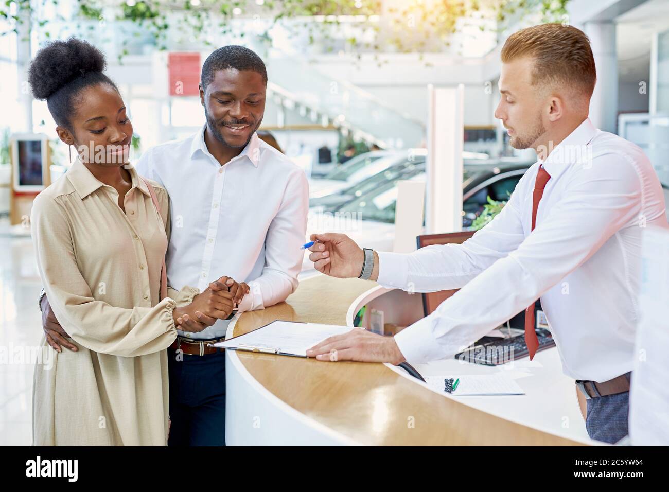 friendly caucasian man administrator and consultant of dealership