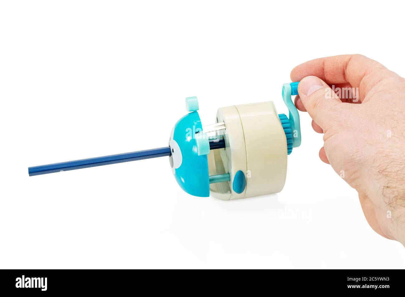 male hand sharpening a pencil twisting the handle of a mechanical