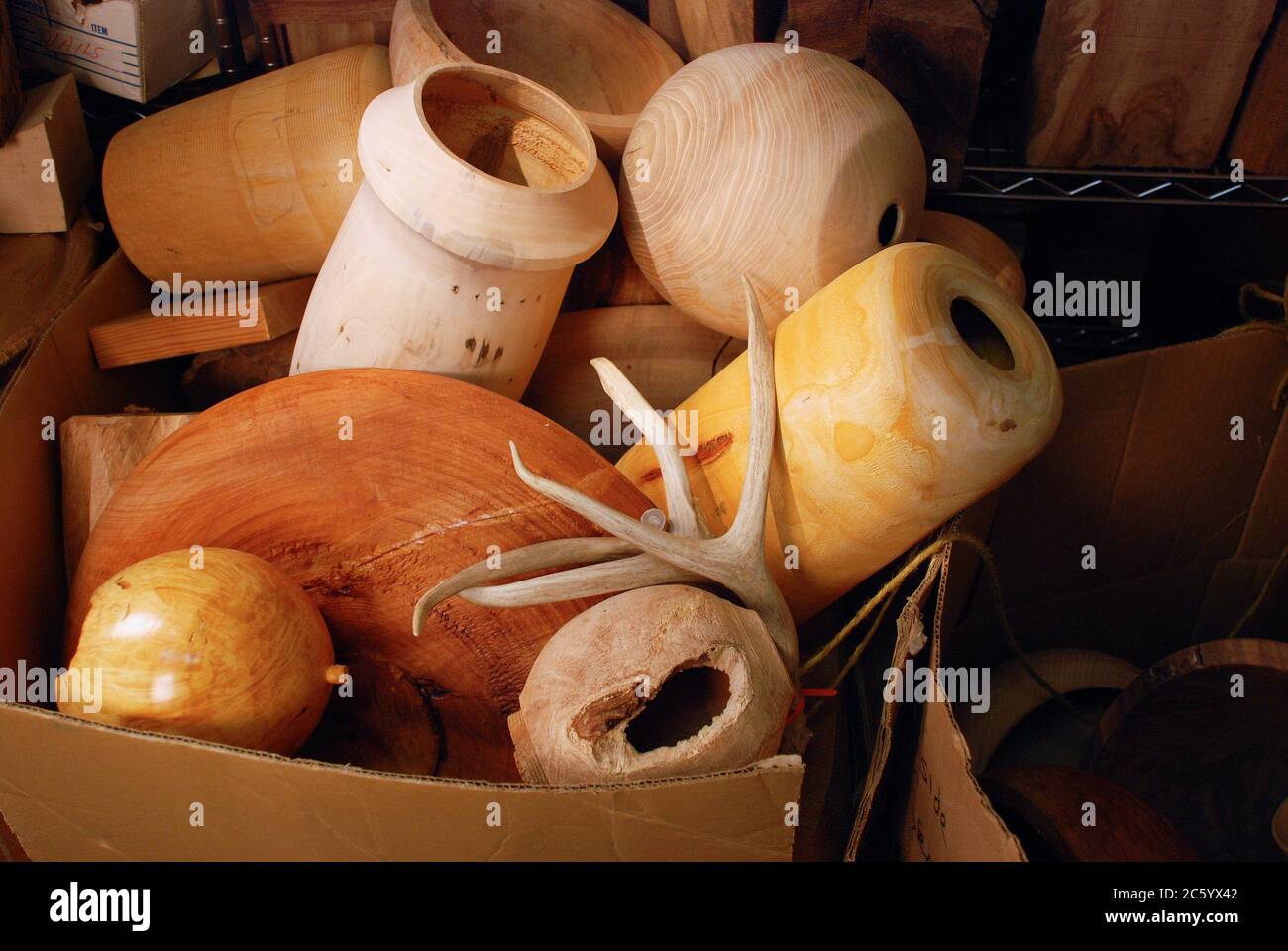 A bin filled with wooden objects Stock Photo