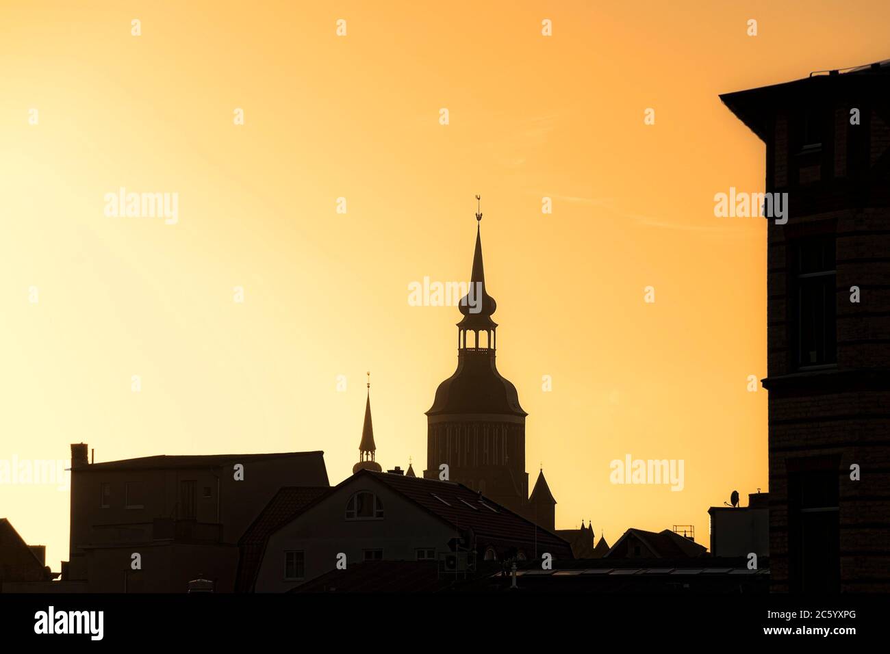 Silhouette of St. Mary´s Church, Hanseatic City Stralsund, Germany, in the evening light of the sinking sun. Stock Photo