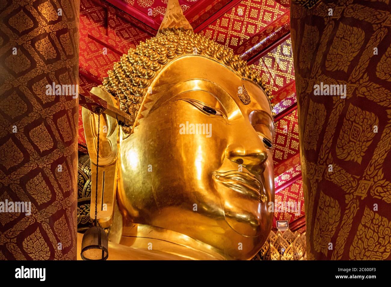 The head of big golden Buddha statute at Buddhist temple - Wat Phanan Choeng Worawihan, Ayutthaya Thailand. Stock Photo