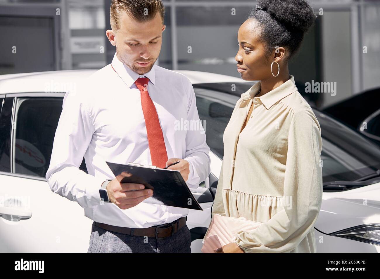 Car salesman sitting desk in hires stock photography and images Alamy