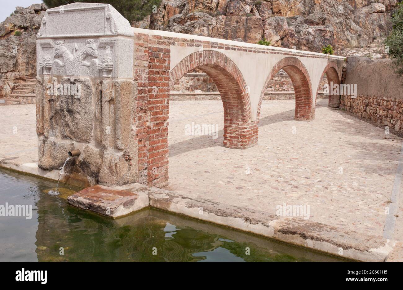 Palomas Pillar fountain built in 16th Century, Hornachos, Spain. Imperial coat of arms of Carlos V carved in the middle. Stock Photo