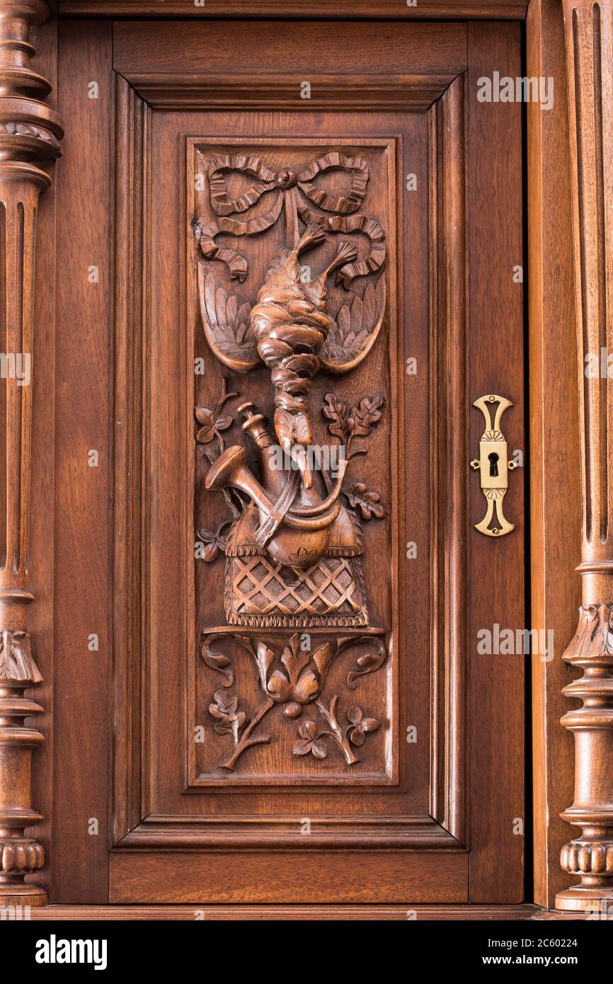 Part of old sideboard as example of beautiful wooden carving background. Stock Photo