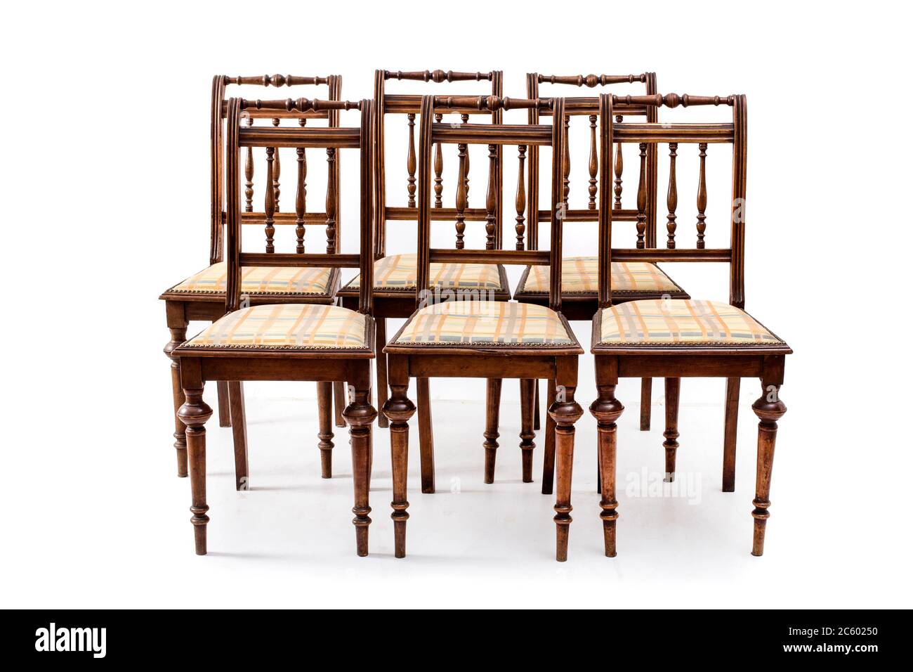 Group of old fashioned wood chairs on the white background. Stock Photo