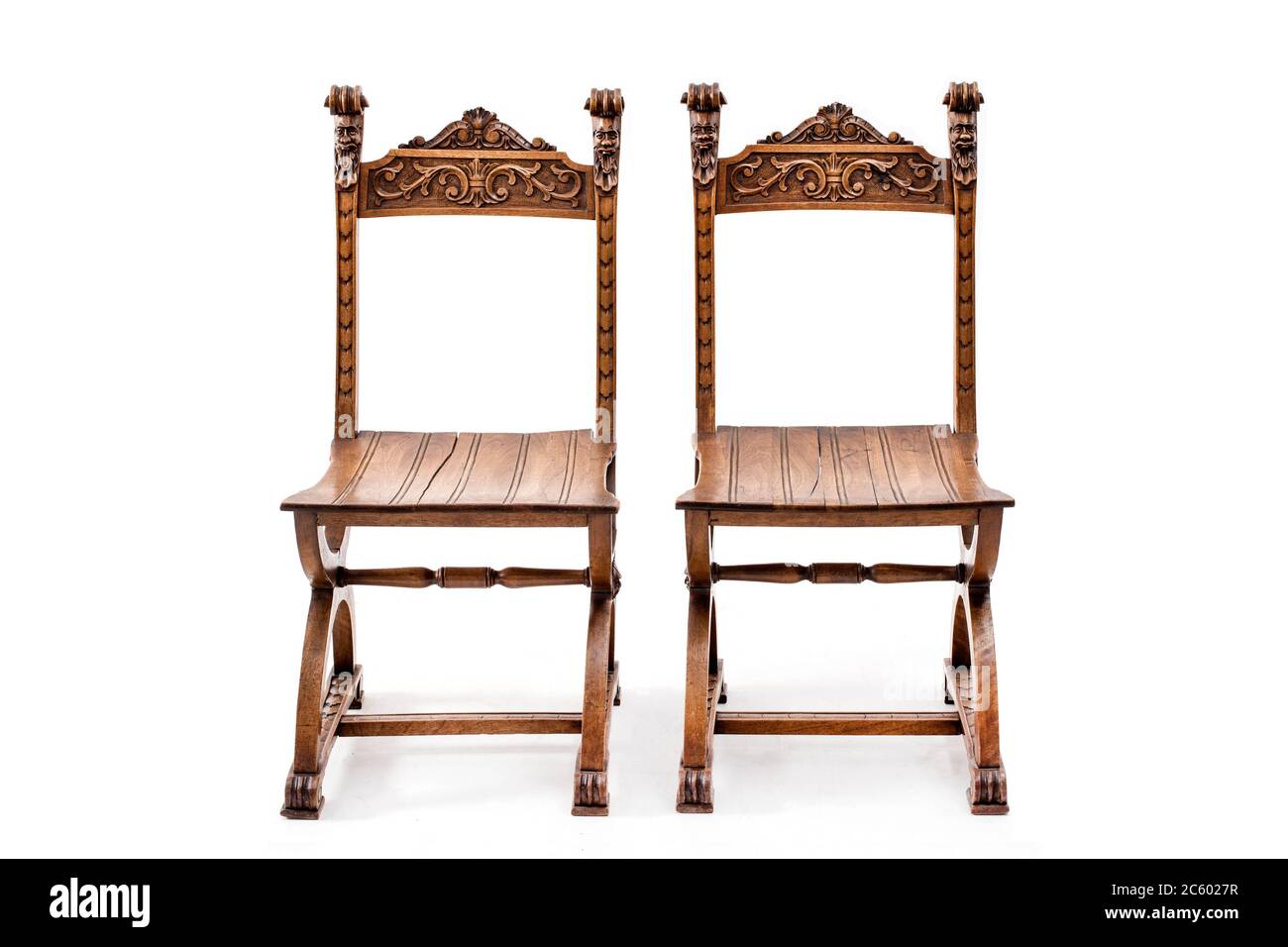 Pair of old fashioned wood chairs on the white background. Stock Photo