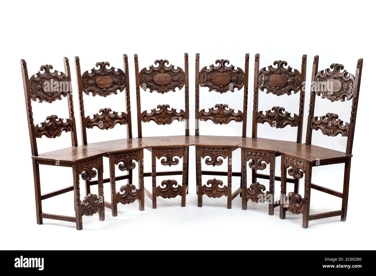 Group of old fashioned wood chairs on the white background. Stock Photo