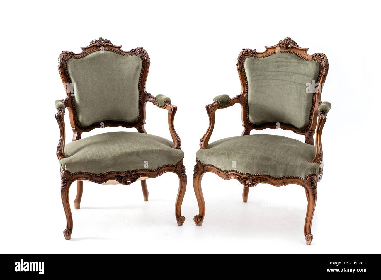 Pair of old fashioned wood armchairs on the white background. Stock Photo