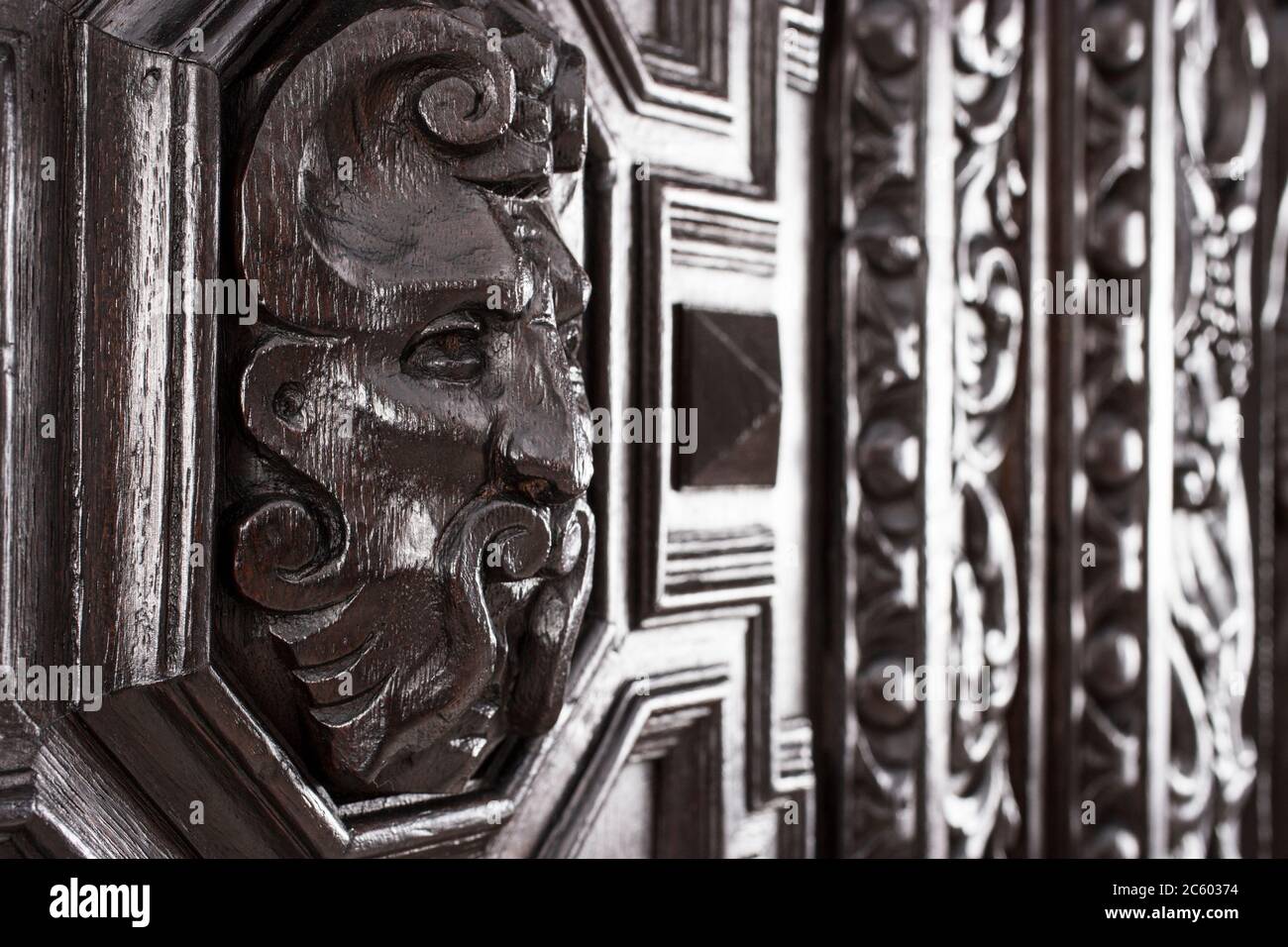 Part of old wardrobe as example of beautiful wooden carving background. Stock Photo