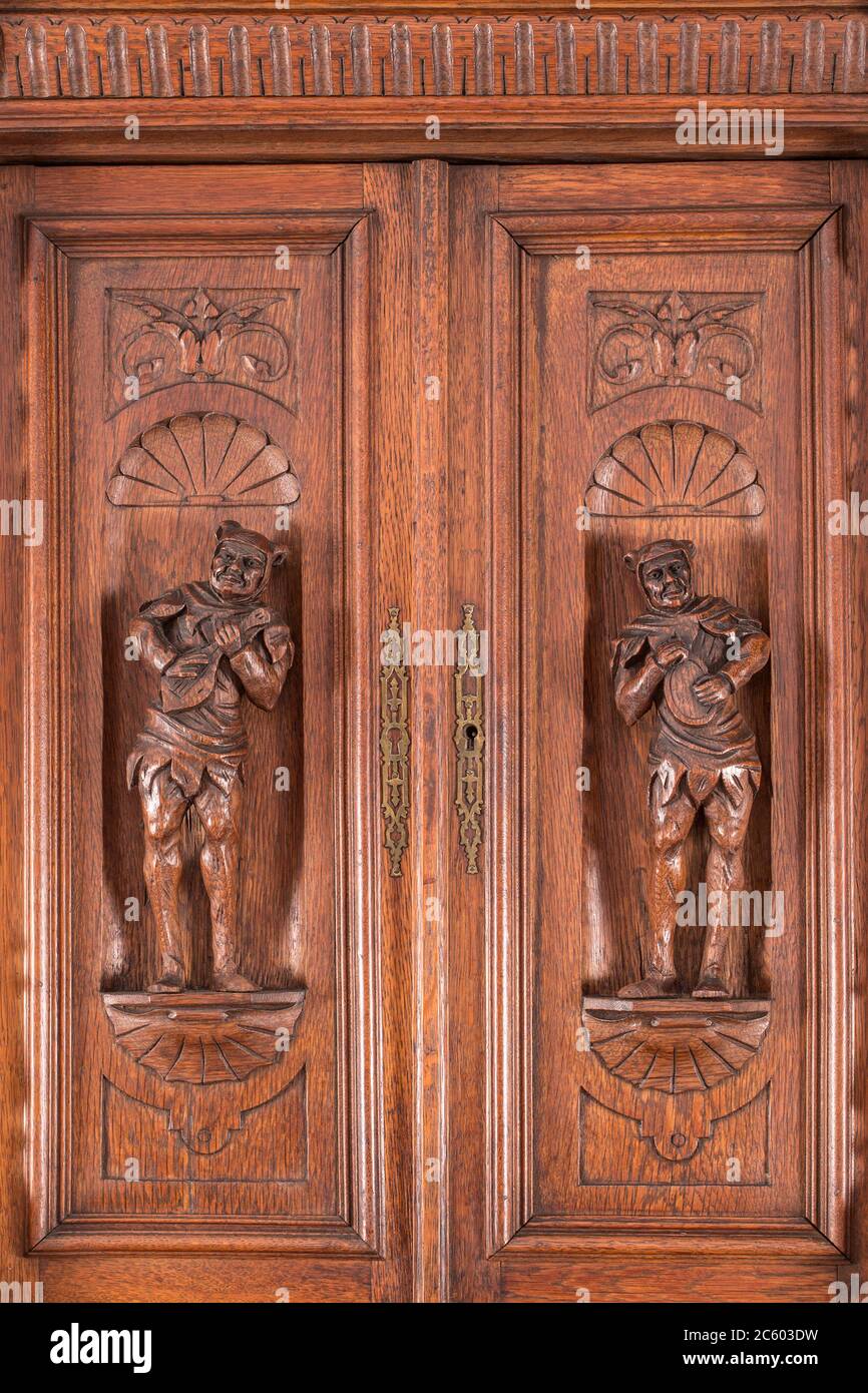 Part of old sideboard as example of beautiful wooden carving background. Stock Photo