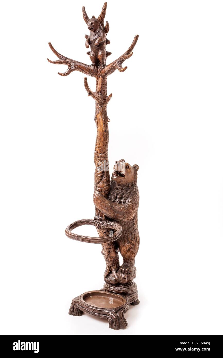 antique coat rack carving in form of tree and two bears Stock Photo