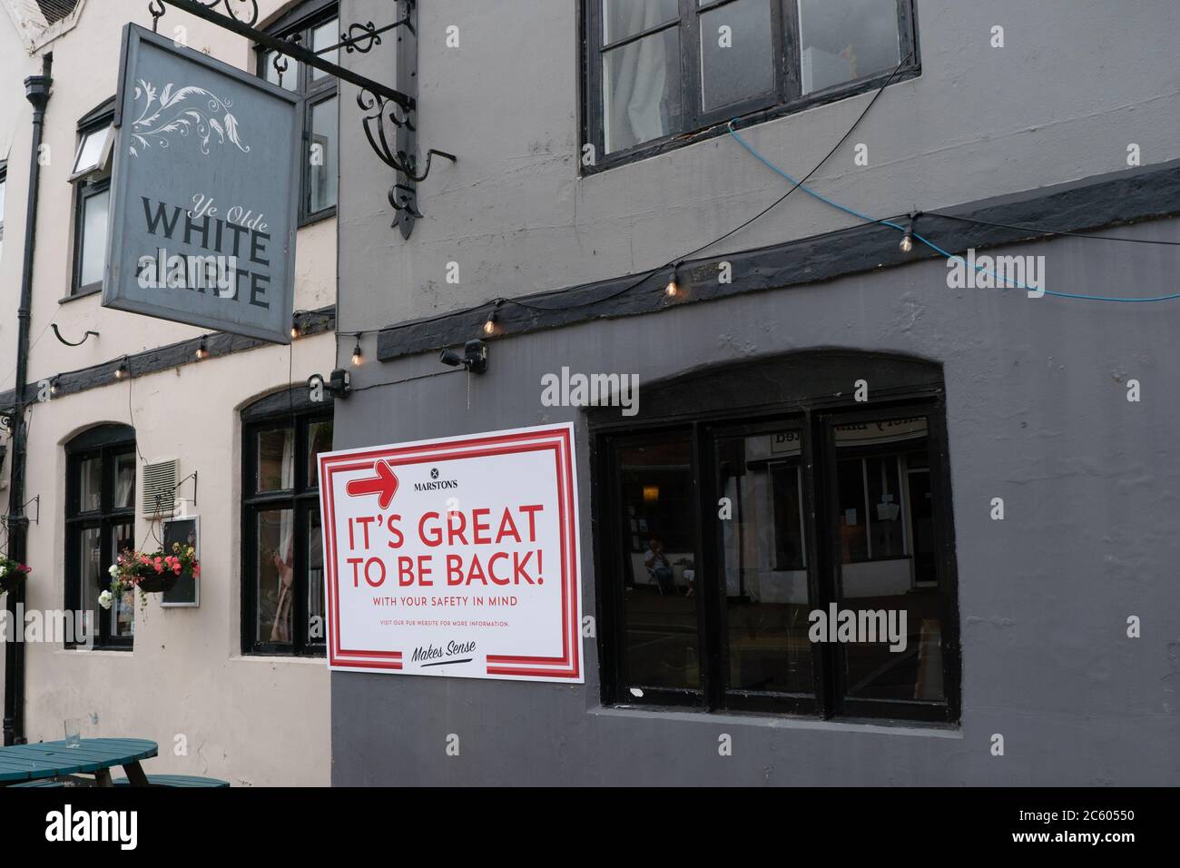 It's Great To Be Back sign on outside wall of pub. Ye Olde White Harte. Kinver. July 5th 2020. Covid-19 Pandemic. UK Stock Photo
