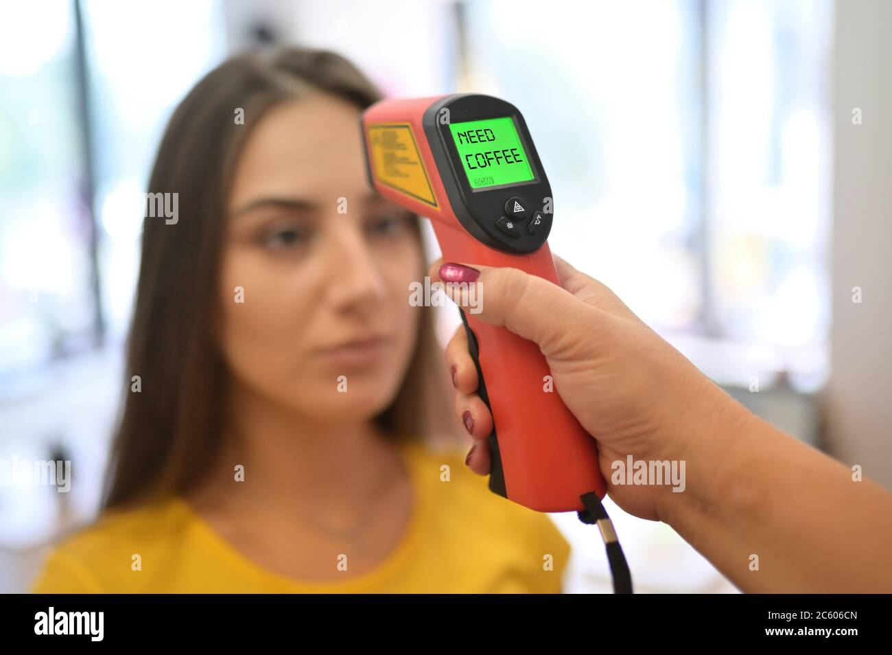 Conceptual Need Cofffe Using Forehead Thermometer Gun Stock Photo Alamy