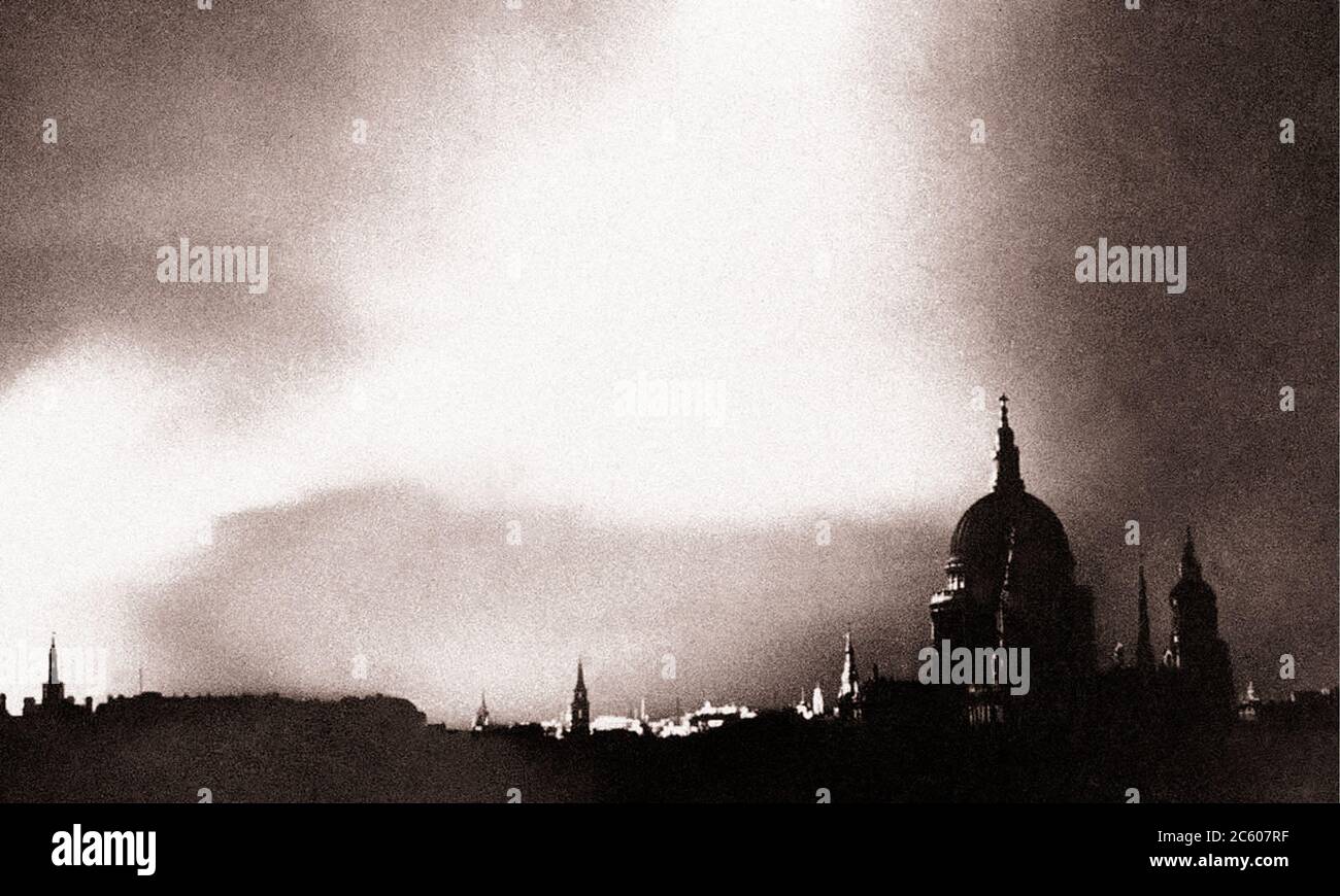 Fires rage in the city of London after a lone German bomber had dropped incendiary bombs close to the heart of the city on September 1, 1940. Stock Photo
