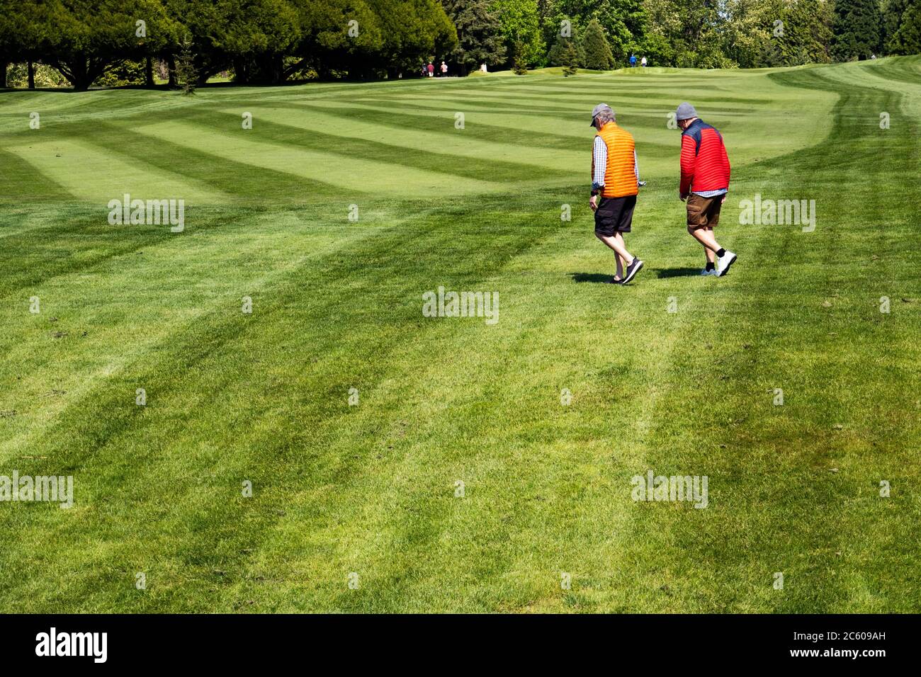 People walk on a golf course in Vancouver, BC, Canada during the covid-19 epidemic. Stock Photo