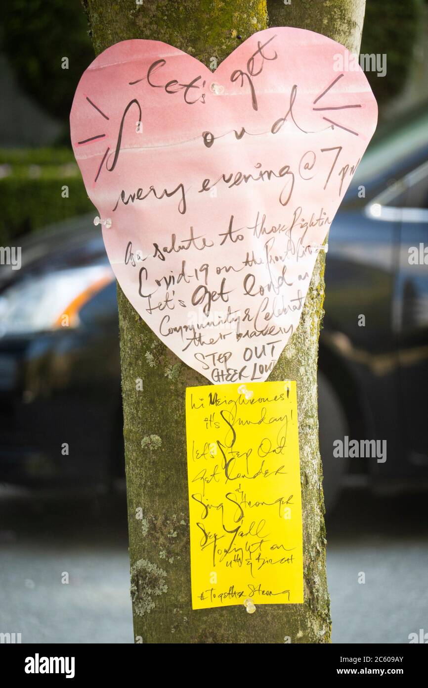Messages on a tree in Vancouver, BC, Canada, during the covid-19 pandemic. Stock Photo