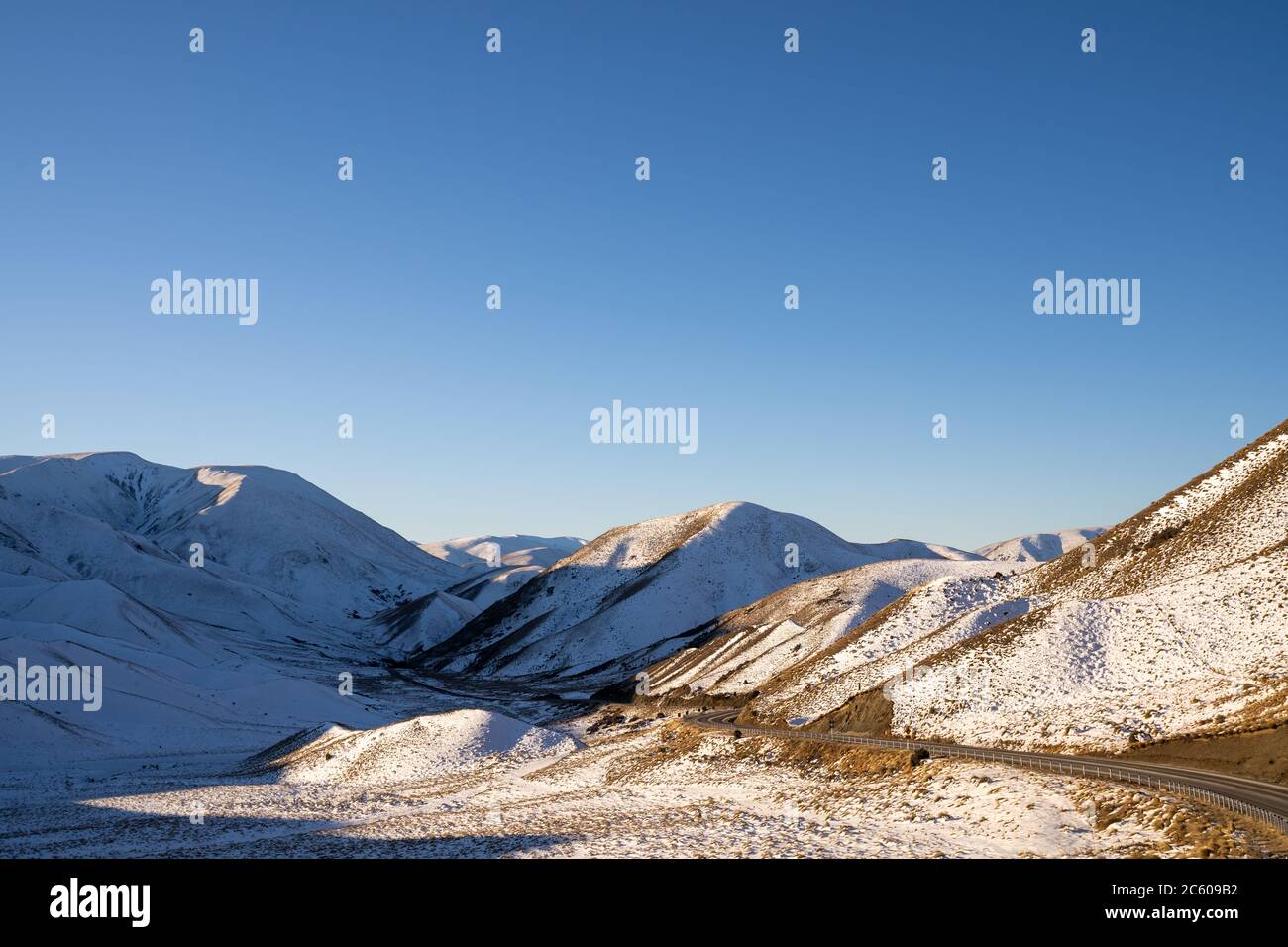 Panorama of Snow Mountain Range Landscape with Blue Sky background from New Zealand. Stock Photo